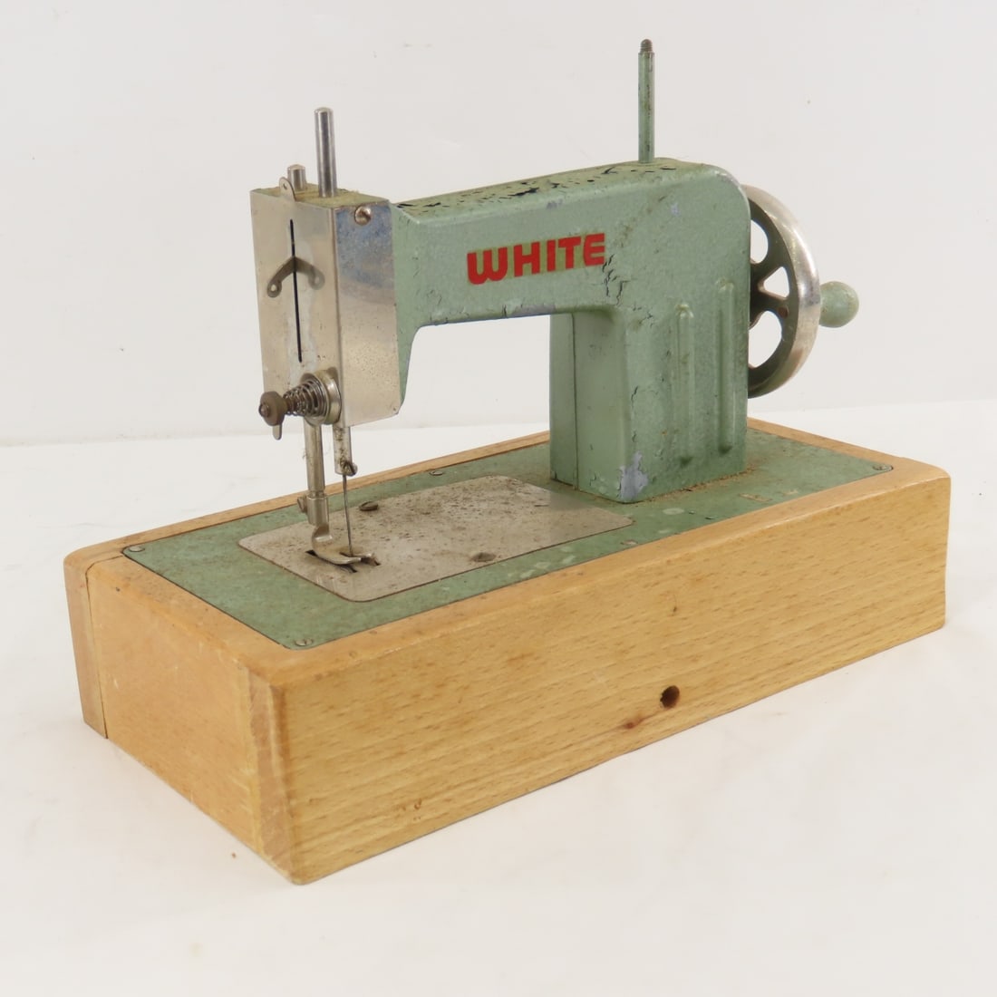 White Child's Sewing Machine: White Child's Sewing Machine - seems to be locked up- not working. Made in Berlin Germany - US Zone LOT SIZE: 10x6x8" 3 LBS All information and photos, which are part of the description, are intended 