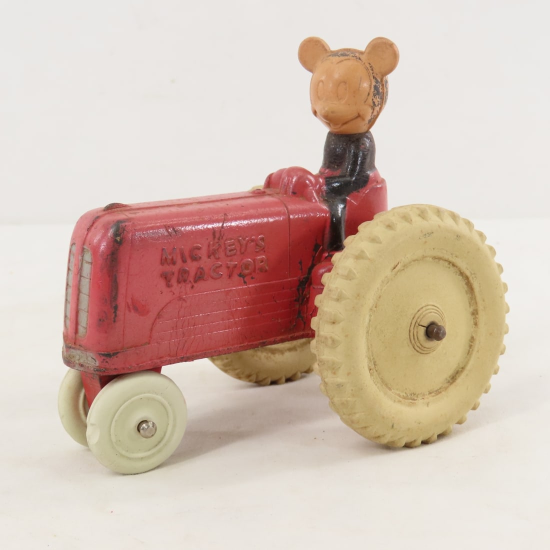 1930's Sun Rubber Co Mickey's Tractor: 1930's Sun Rubber Co Mickey's Tractor - 1 front tire has small chunk missing. LOT SIZE: 5x5x4" 1 LB All information and photos, which are part of the description, are intended to be as accurate as