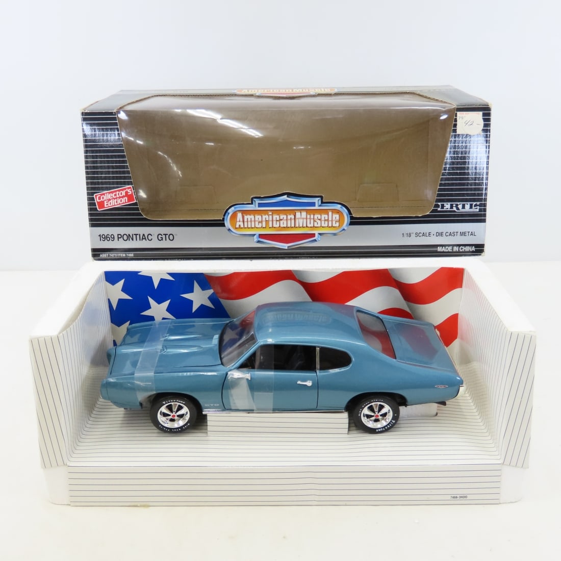 American Muscle 1969 GTO 1/18 Diecast in Box: American Muscle 1969 GTO 1/18 Diecast in Box - LOT SIZE: 15x7x6" 3 LBS All information and photos, which are part of the description, are intended to be as accurate as possible, but errors are possibl