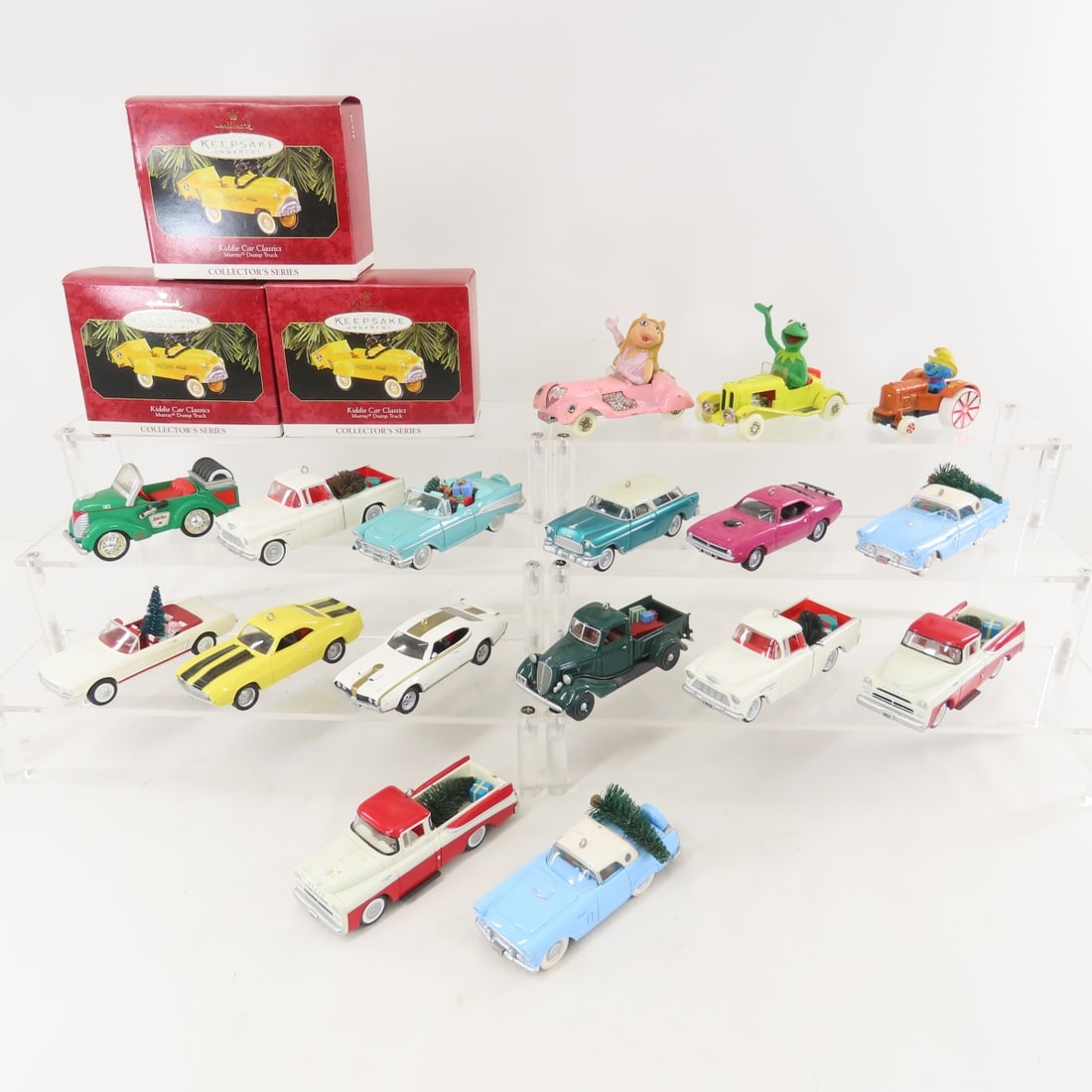 Hallmark Christmas Car Ornaments & Corgi Muppets: Hallmark Christmas Car Ornaments & Corgi Muppets - Corgi Kermit The Frog & Miss Piggy Cars, 13 Hallmark Cars & Trucks Christmas Ornaments, 3 Pedal Car Ornaments in box. LOT SIZE: 16x10x4" 3 LBS All