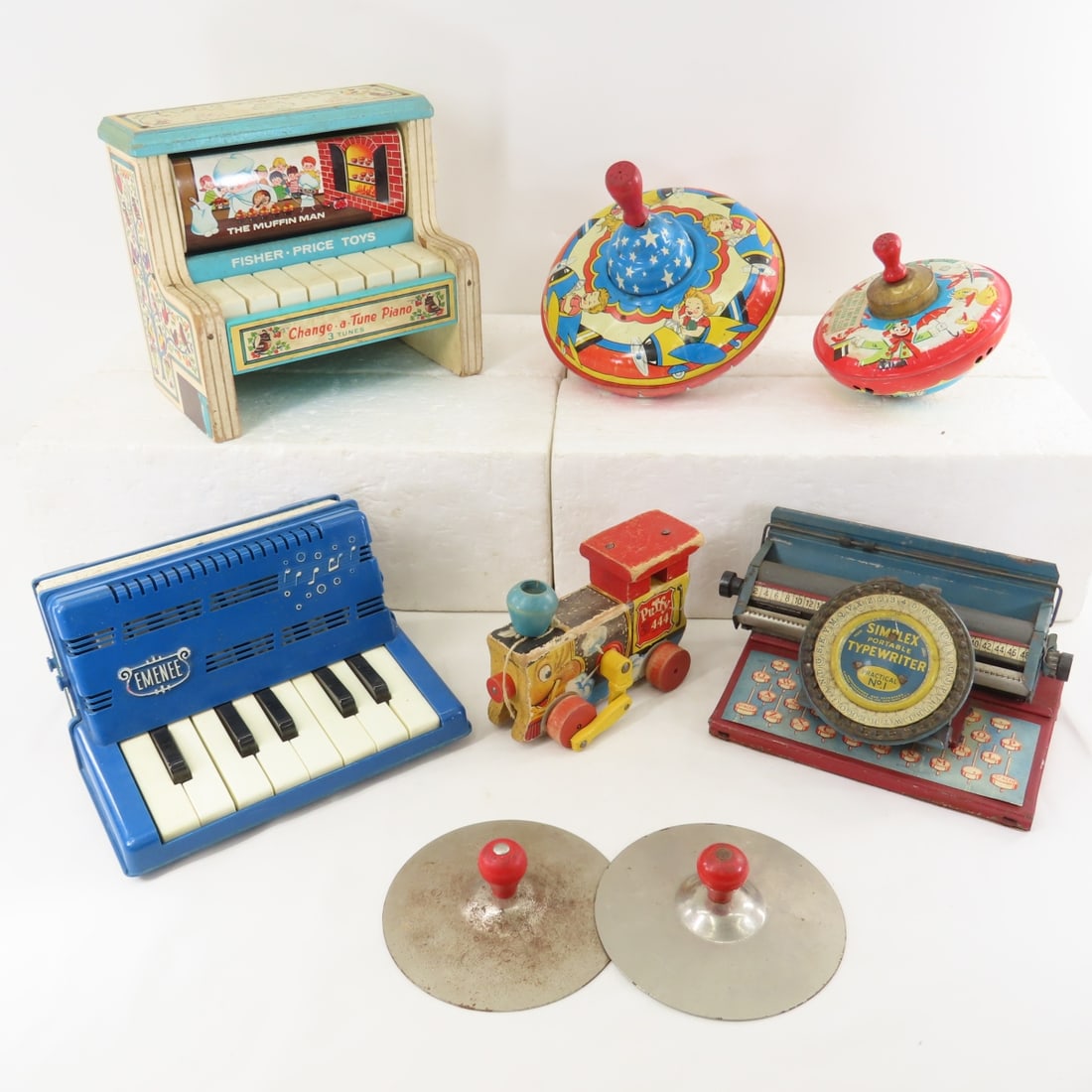 Vintage Toy Piano, Accordion, Typewriter & More: Vintage Toy Piano, Accordion, Typewriter & More - Simplex Portable Typewriter No. 1, Fisher Price Puffy 444 Train Engine, Change-A-Tune Piano(non-working), Emenee Accordion, Push-Down Spinning Tops.