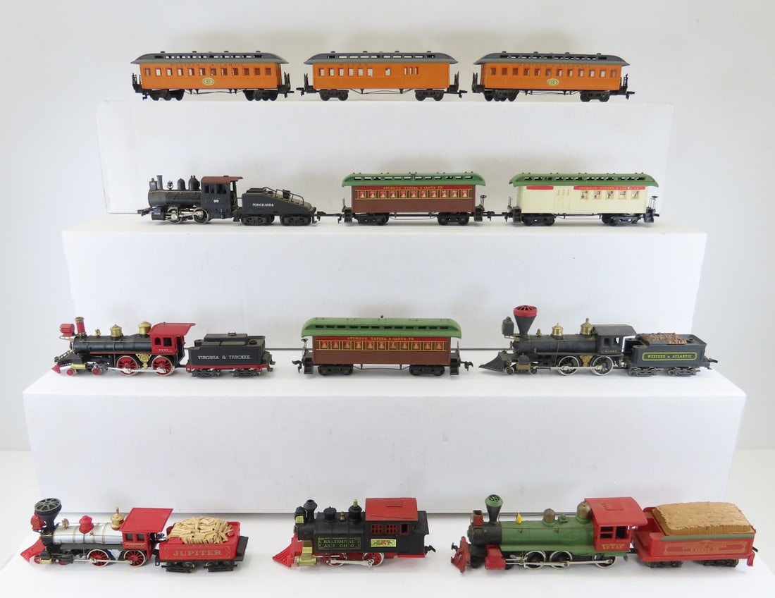 2 HO Scale Sets and 4 Additional Engines: 2 HO Scale Sets and 4 Additional Engines - Rivarossi, Bachmann, 1 made in Hong Kong, 1 made in Yugoslavia, Pocher Western Atlantic - with 3 passenger cars, Tyco AT&SF with 3 cars. LOT SIZE: 16x9x2" 4 
