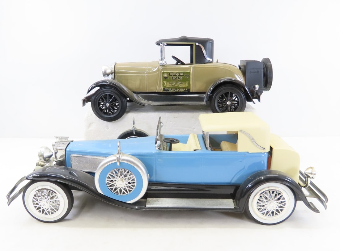 2 Jim Beam Whiskey Car Decanters: 2 Jim Beam Whiskey Car Decanters - both are full (we have to empty for shipping) 1928 Ford Model A & Duesenberg Model J, LOT SIZE: 18x16x7" 12 LBS All information and photos, which are part of the