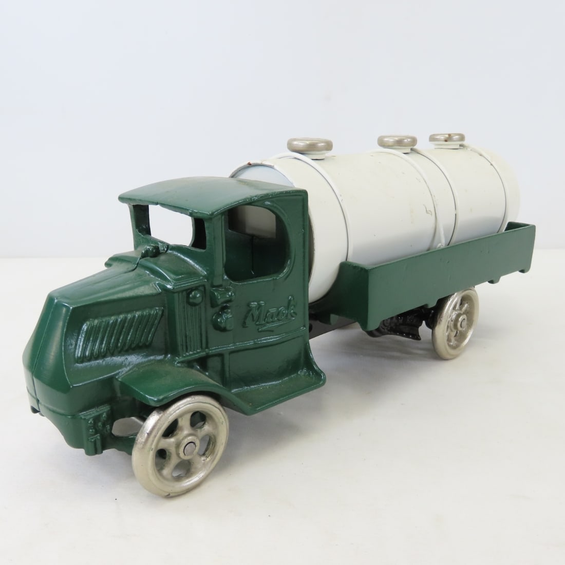 Repainted Arcade Cast Iron Mack Tanker Truck: Repainted Arcade Cast Iron Mack Tanker Truck - LOT SIZE: 13x6x5" 7 LBS All information and photos, which are part of the description, are intended to be as accurate as possible, but errors are possibl