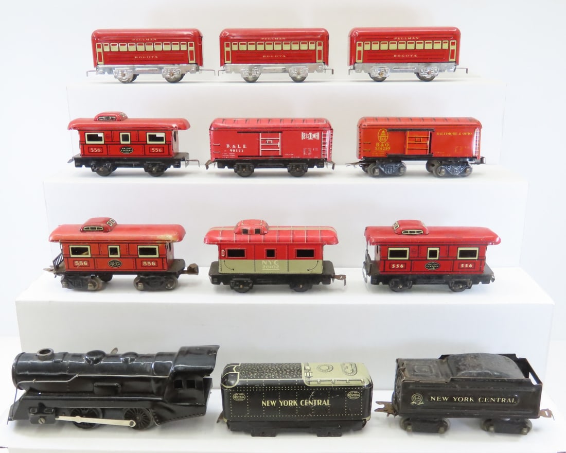 Marx Key Wind O Gauge Tin Litho Train Set: Marx Key Wind O Gauge Tin Litho Train Set - engine (works), tender, 7 cars/caboose, 1 NYC car missing wheels, 2 additional cars with different connectors. LOT SIZE: 14x13x4" 5 LBS All information and
