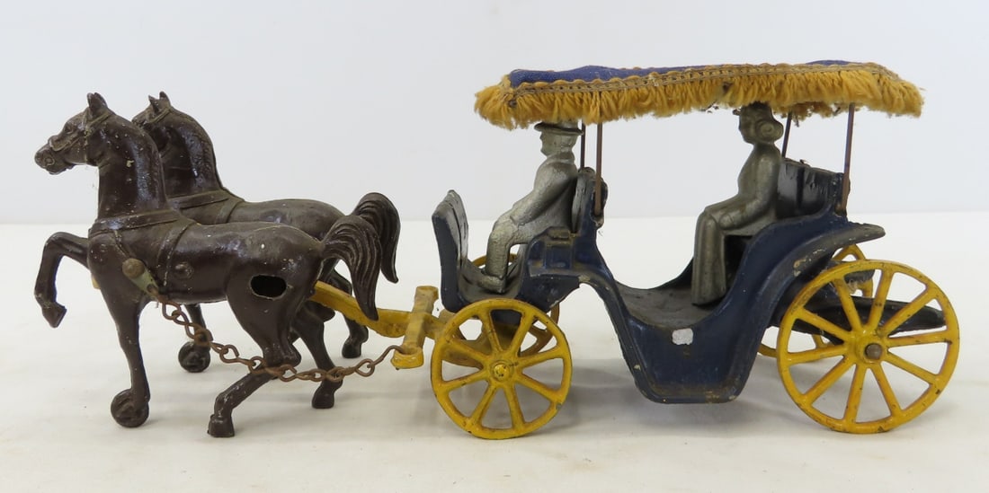 1940s Stanley Toys Cast Iron Horse Drawn Carriage: 1940s Stanley Toys Cast Iron Horse Drawn Carriage - paint is flaking, driver, passenger & fringed roof. LOT SIZE: 11x4x5" 2 LBS All information and photos, which are part of the description, are