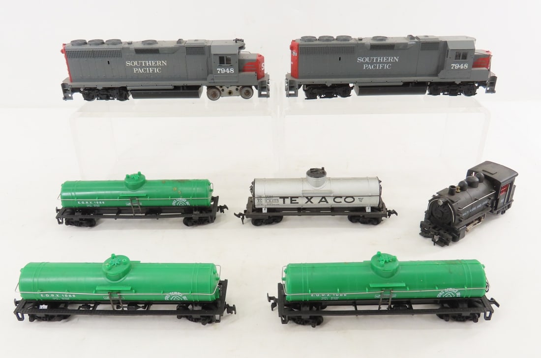 3 Unbranded HO Scale Engines and 4 Cars: 3 Unbranded HO Scale Engines and 4 Cars - 2 unbranded SP 7948 engines, unbranded B&O 98 steam engine, and 4 tanker cars all marked made in Hong Kong, LOT SIZE: 8x10x" 3 LBS All information and