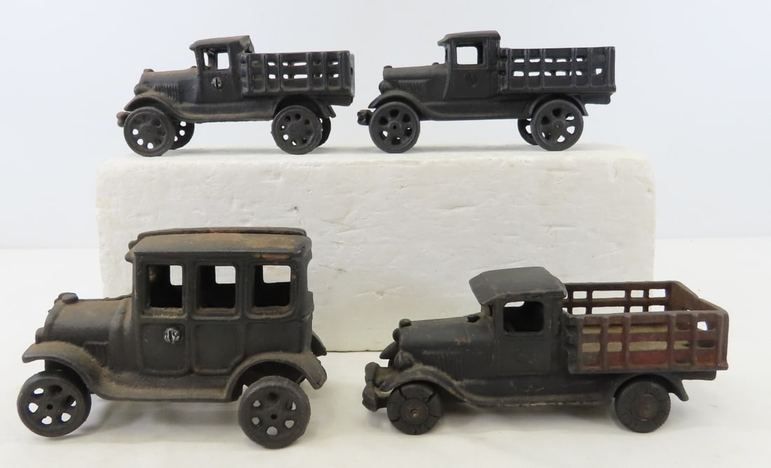 4 Vintage Cast Iron Toy Cars and Trucks: 4 Vintage Cast Iron Toy Cars and Trucks - all unmarked. LOT SIZE: 11x7x4" 8 LBS All information and photos, which are part of the description, are intended to be as accurate as possible, but errors ar