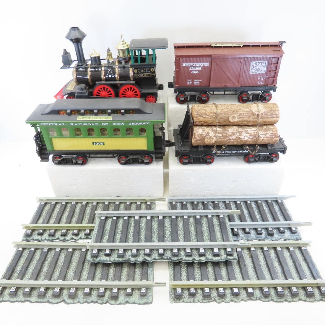 4 Piece Jim Beam Whiskey Train Decanter Set: 4 Piece Jim Beam Whiskey Train Decanter Set - Grant 1872 engine- open, 1099 Central Railroad of New Jersey passenger car - sealed, Jersey & Western Railway 1890 box car- sealed, Jersey & Western