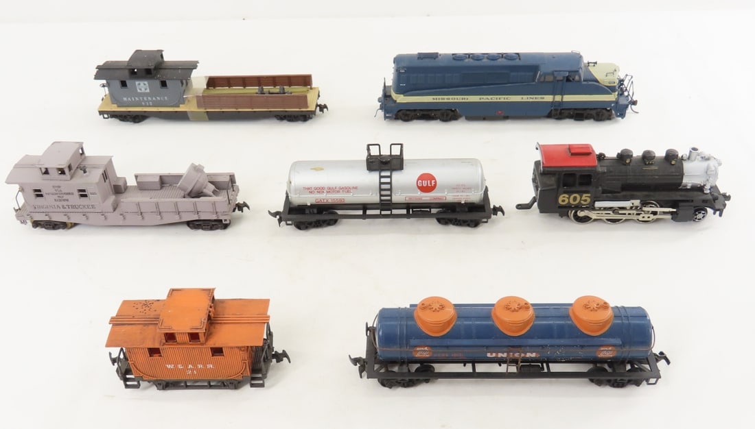 7 Life-Like, Tyco & other HO Scale Cars & Engines: 7 Life-Like, Tyco & other HO Scale Cars & Engines - 605 steam engine made in Macau, Life-Like MP diesel, Gulf tanker made in Yugoslavia, Tyco Santa Fe maintenance car, and 3 unbranded cars. LOT SIZE: