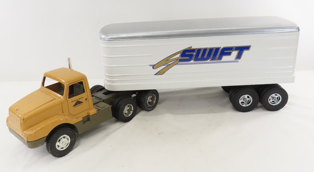 ERTL McClinton-Anchor Tractor & Swift Trailer: ERTL McClinton-Anchor Tractor & Swift Trailer - 19" trailer- repainted, 1/24 diecast, cab has plastic frame. LOT SIZE: 20x13x10" 5 LBS All information and photos, which are part of the description,
