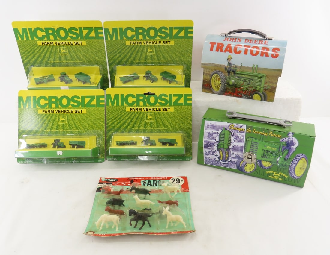 John Deere Micro Size Toys, Lunch Boxes & More: John Deere Micro Size Toys, Lunch Boxes & More - 4 packs new Micro size farm toys 2, lunch boxes, hat ornament, and B-Line toys farm animal set on card- water damage. LOT SIZE: 13x9x10" 3 LBS All info
