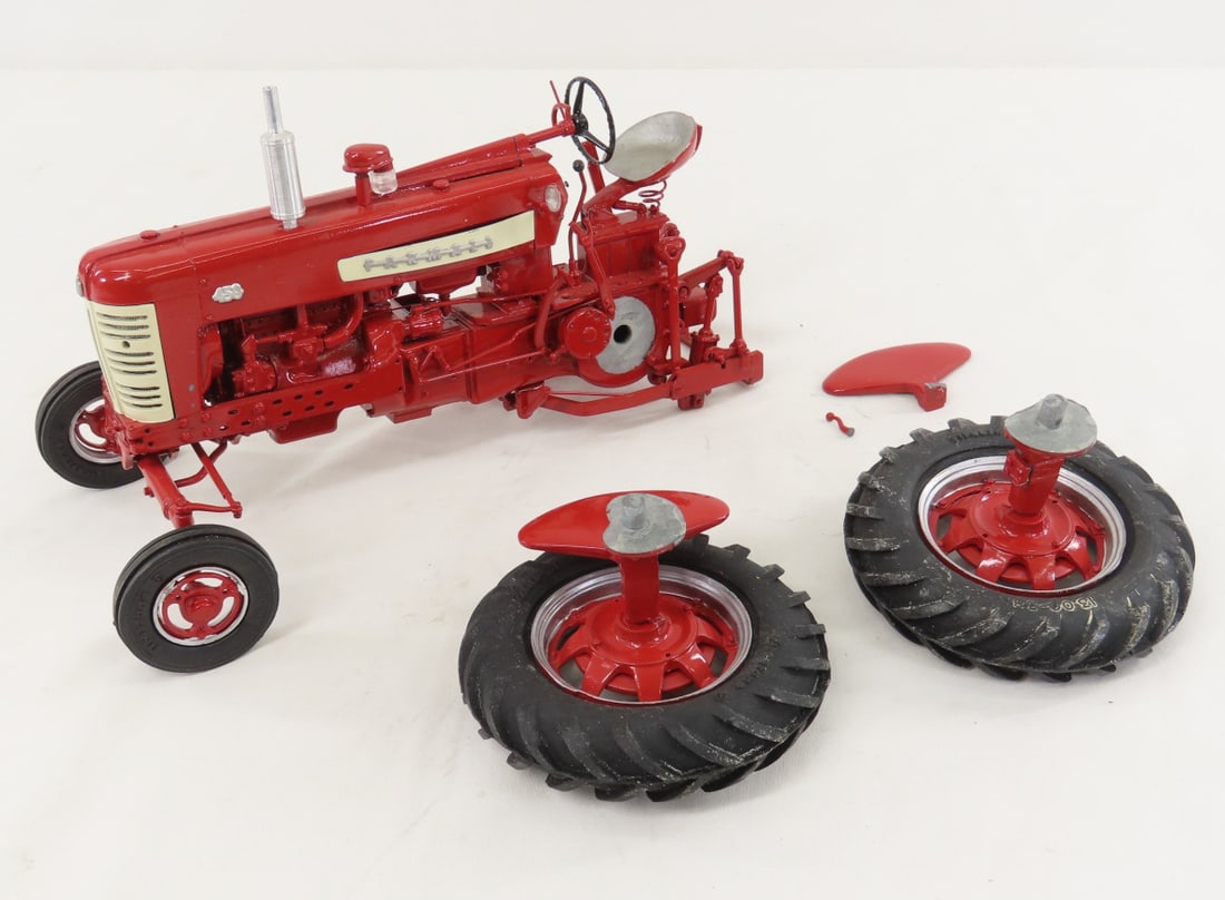 Gilson Riecke Farmall 450 Tractor- damaged: Gilson Riecke Farmall 450 Tractor- damaged - rear wheels are broken off, looks like could be glued easily for display, 1/16 diecast, LOT SIZE: 11x6x6" 3 LBS All information and photos, which are part