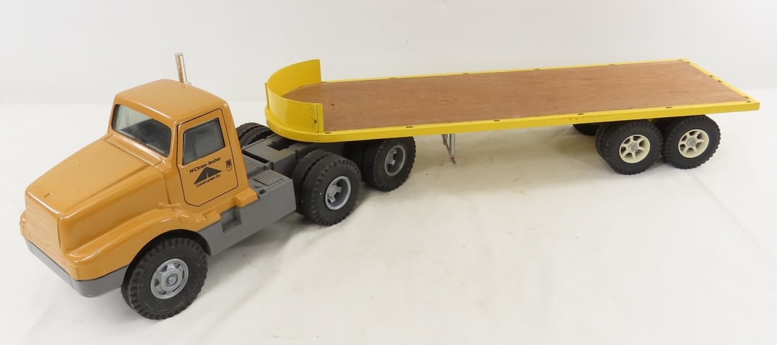 ERTL McClinton-Anchor Tractor & Custom Flat Bed: ERTL McClinton-Anchor Tractor & Custom Flat Bed - cab has plastic base, approx 1/24 wood flat bed, LOT SIZE: 21x12x8" 6 LBS All information and photos, which are part of the description, are intended