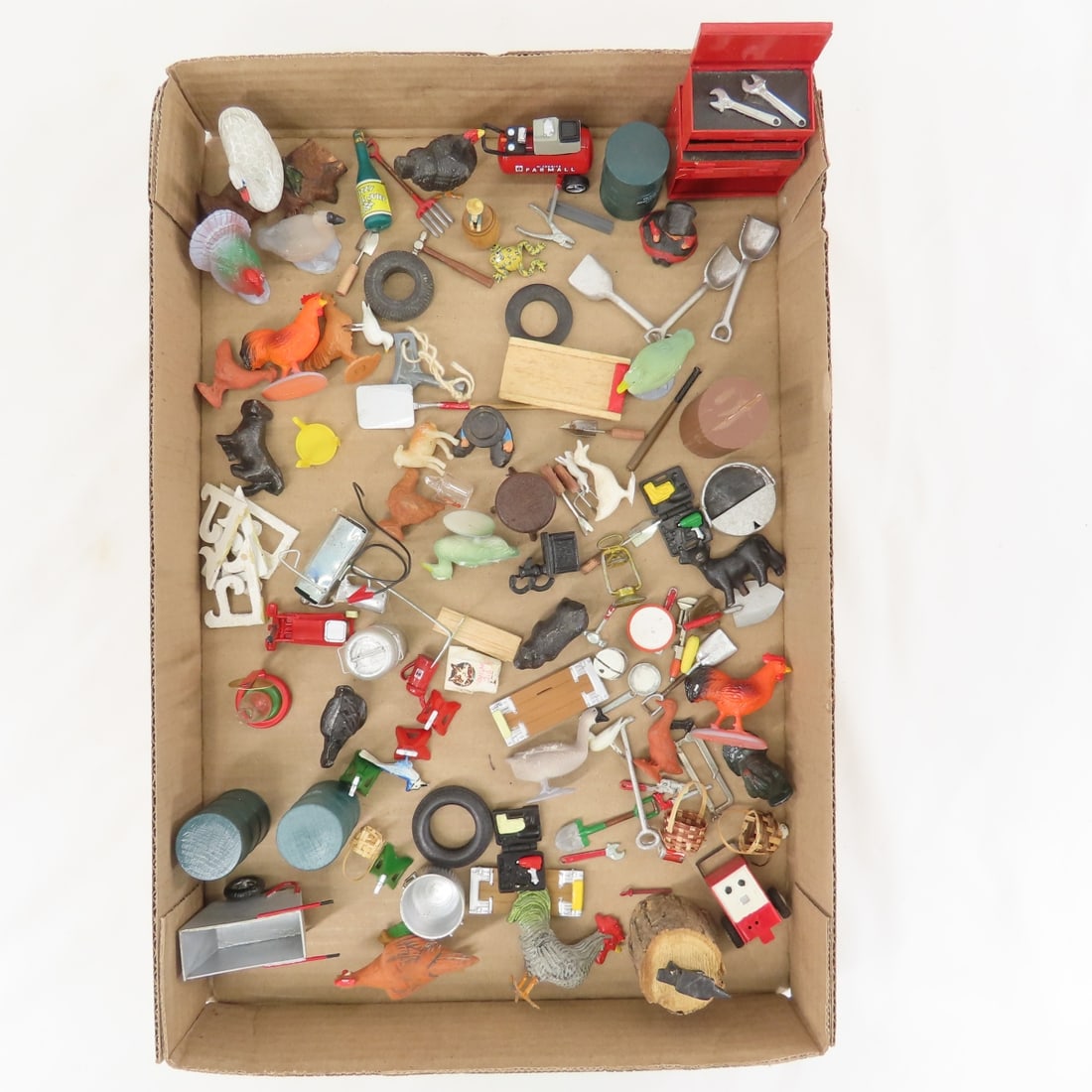 Metal, Wood, Plastic & Ceramic Miniatures: Metal, Wood, Plastic & Ceramic Miniatures - Farmall tank, tool box, animals, and more. LOT SIZE: 10x10x8" 2 LBS All information and photos, which are part of the description, are intended to be as acc