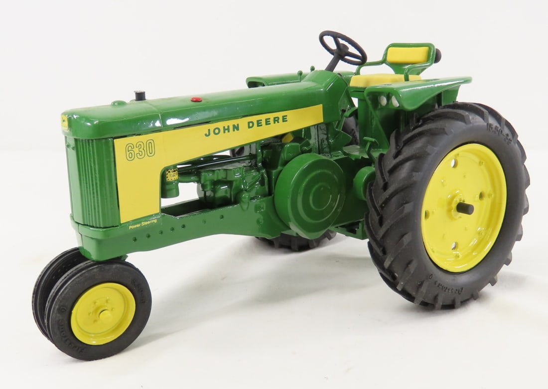 Eagle Toys John Deere 630 NF Tractor- damaged: Eagle Toys John Deere 630 NF Tractor- damaged - front wheels have snapped off- could easily glue for display. 3 pt hitch, 1/16 diecast, LOT SIZE: 10x6x5" 4 LBS All information and photos, which are