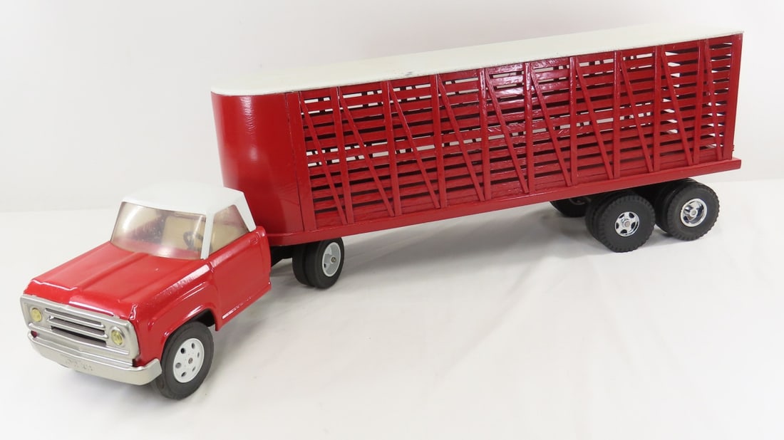 Red Painted Tonka Truck & Custom Cattle Trailer: Red Painted Tonka Truck & Custom Cattle Trailer - wood trailer- rear wheels fall off axle, truck has MARX wheels, Approx 1/24 scale. LOT SIZE: 24x11x10" 8 LBS All information and photos, which are