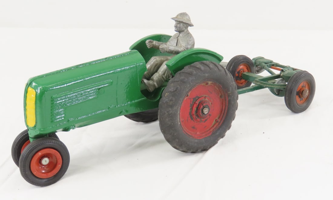 Slik Toys Oliver Tractor, Driver & Sickle Mower: Slik Toys Oliver Tractor, Driver & Sickle Mower - tractor has been repainted and missing steering wheel, driver is not original and not attached, mower is unmarked. LOT SIZE: 8x8x4" 2 LBS All
