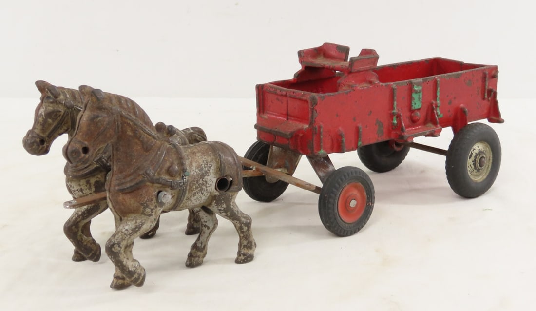Cast Iron Horse Drawn Wagon with Custom Hitch: Cast Iron Horse Drawn Wagon with Custom Hitch - unmarked, back of wagon seat has broken piece. LOT SIZE: 11x3x4" 3 LBS All information and photos, which are part of the description, are intended to