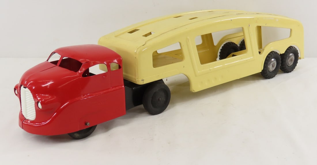 Custom Pressed Steel Car Hauler: Custom Pressed Steel Car Hauler - approx 1/30 scale LOT SIZE: 16x9x5" 3 LBS All information and photos, which are part of the description, are intended to be as accurate as possible, but errors are po