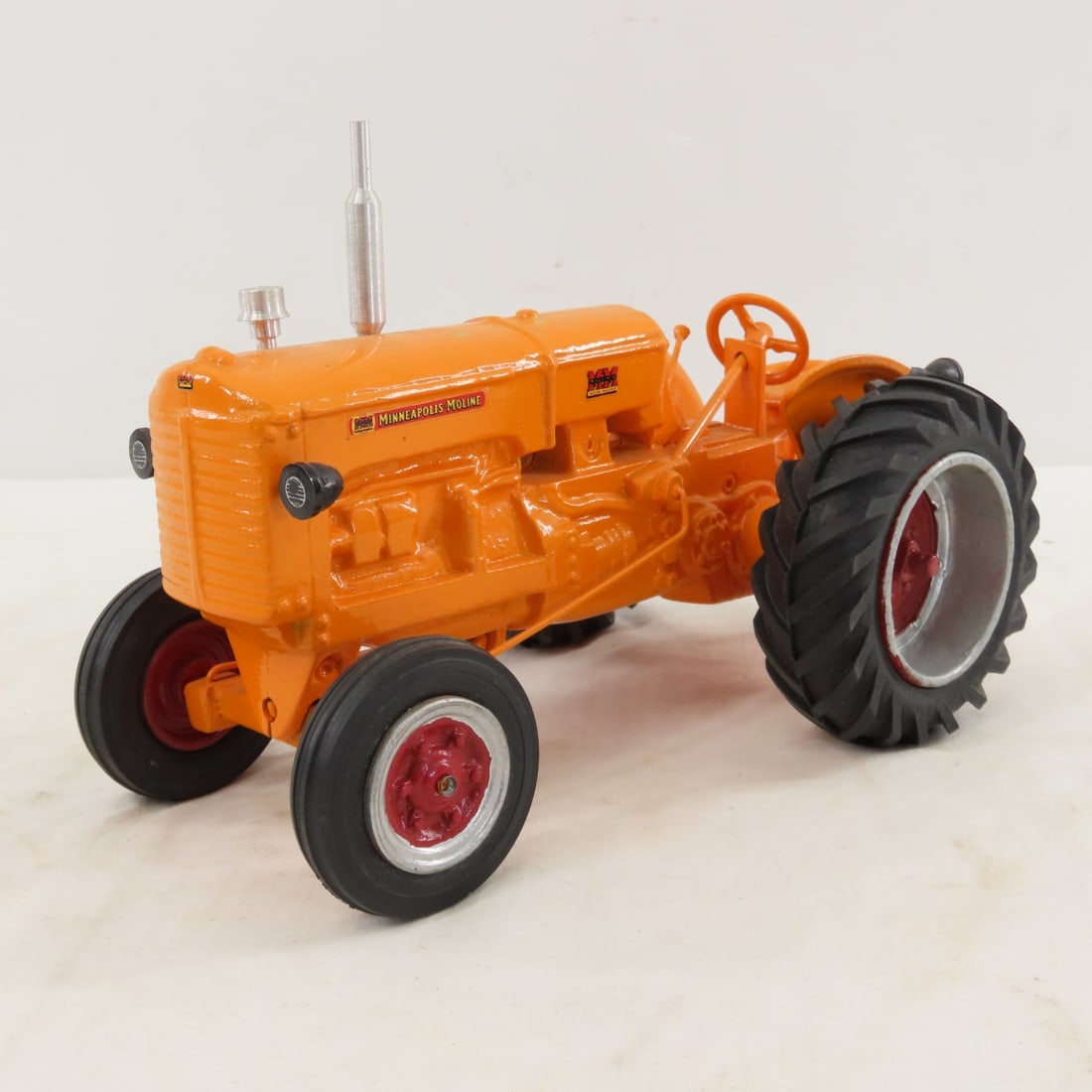 Custom Minneapolis-Moline Tractor: Custom Minneapolis-Moline Tractor - looks like a Mohr LOT SIZE: 9x6x6" 3 LBS All information and photos, which are part of the description, are intended to be as accurate as possible, but errors are