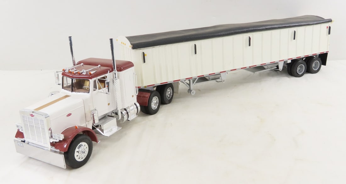 RV-MM LLC Plastic Model Peterbilt Tractor Trailer: RV-MM LLC Plastic Model Peterbilt Tractor Trailer - hand painted plastic , trailer has faux leather cover. LOT SIZE: 27x5x7" 3 LBS All information and photos, which are part of the description, are