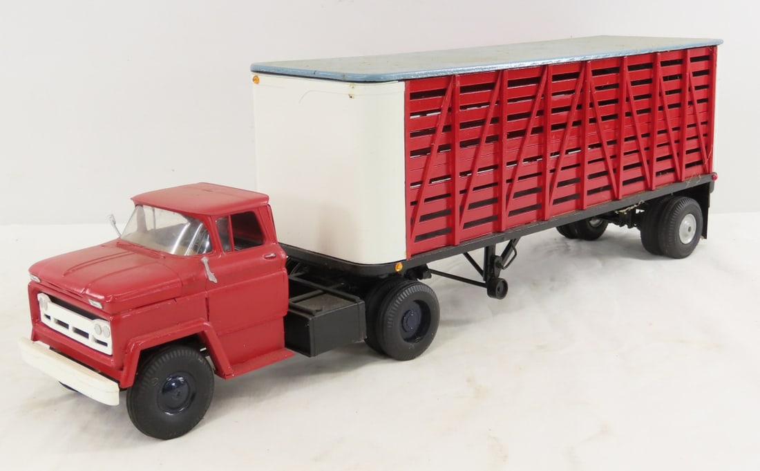 Custom Wood Model Tractor & Cattle Trailer: Custom Wood Model Tractor & Cattle Trailer - very fragile, doors do not open, unmarked, 1 mirror on truck is loose, approx 1/24 scale. LOT SIZE: 20x5x6" 2 LBS All information and photos, which are