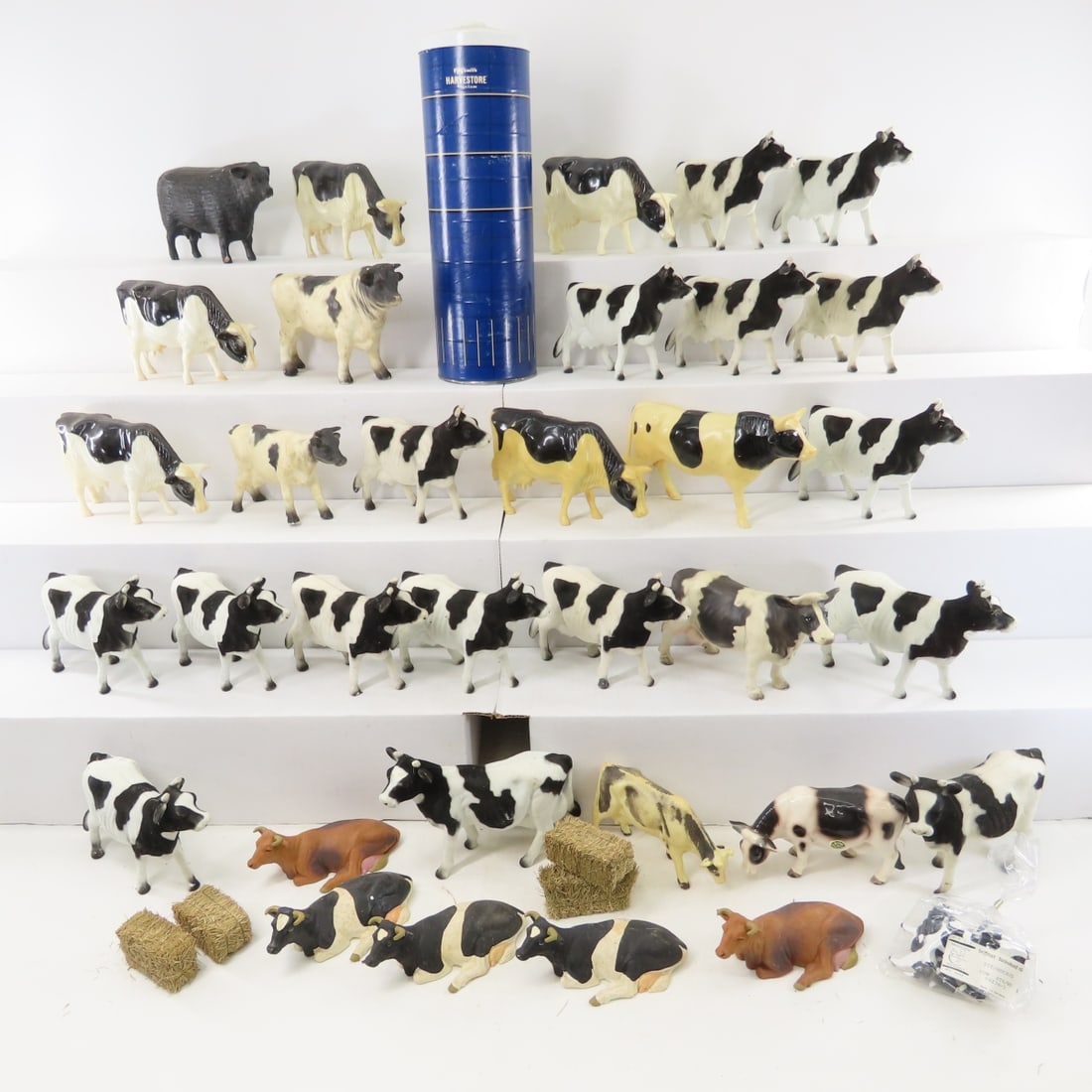 Plastic & Ceramic Cows & Harvestore Silo: Plastic & Ceramic Cows & Harvestore Silo - 5 seated rubber Schleich Cows, 1 unmarked plastic black angus, Marvel Trading Holstein & Calf- plastic, 6 molded plastic Holsteins & 1 calf, 16 felted
