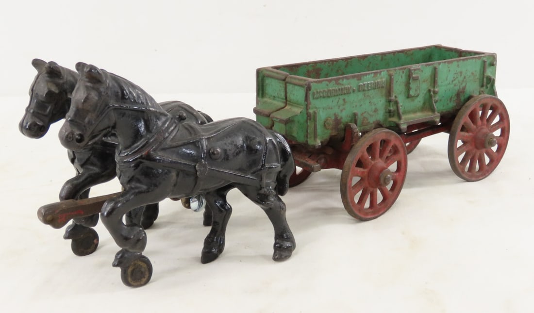 Arcade Cast Iron McCormick-Deering 2 Horse Wagon: Arcade Cast Iron McCormick-Deering 2 Horse Wagon - LOT SIZE: 13x4x5" 4 LBS All information and photos, which are part of the description, are intended to be as accurate as possible, but errors are