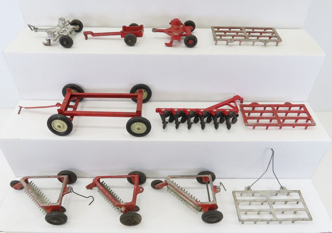 ERTL 6 Bottom Plow & 10 Other Implements: ERTL 6 Bottom Plow & 10 Other Implements - some cast metal, 1 pressed metal wagon frame, all 1/16 scale. LOT SIZE: 10x9x4" 2 LBS All information and photos, which are part of the description, are