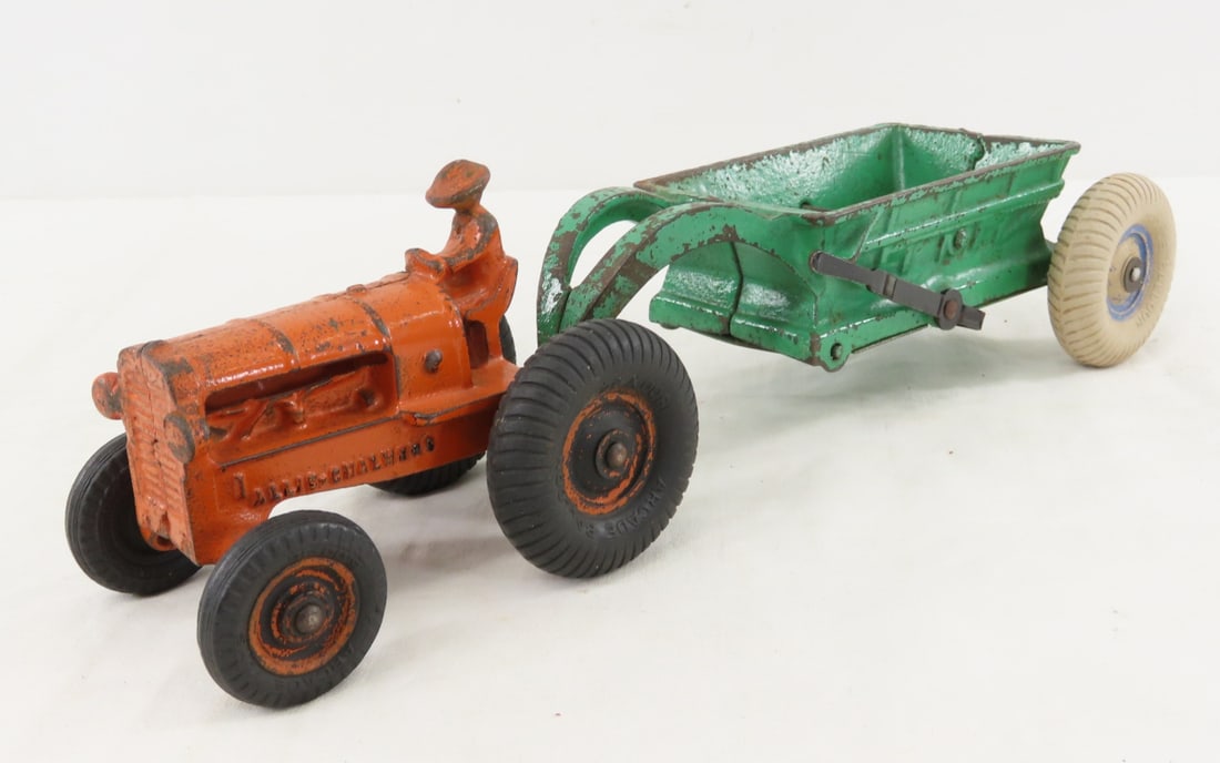 Arcade Cast Iron Allis- Chalmers Tractor & Wagon: Arcade Cast Iron Allis- Chalmers Tractor & Wagon - both have balloon tires, dump works. LOT SIZE: 9x7x4" 3 LBS All information and photos, which are part of the description, are intended to be as