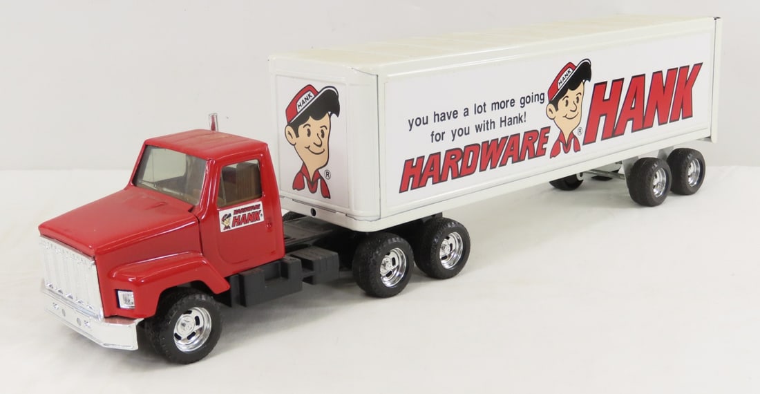 ERTL Hardware Hank Tractor & Trailer: ERTL Hardware Hank Tractor & Trailer - stock #3605, 1/25 scale diecast. LOT SIZE: 14x7x5" 3 LBS All information and photos, which are part of the description, are intended to be as accurate as