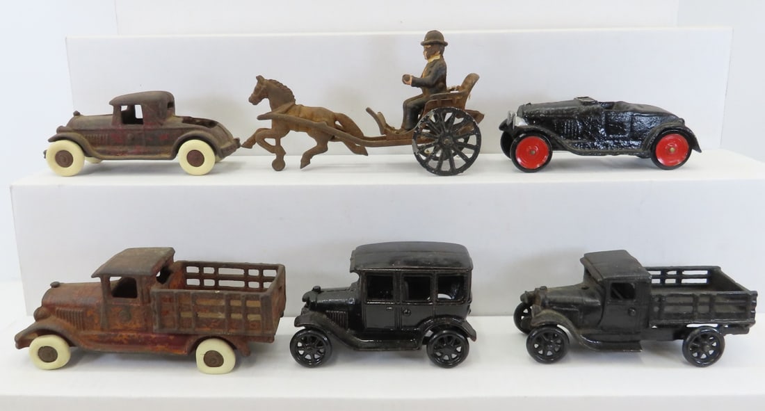 1 Arcade & 5 Other Cast Iron Toy Cars: 1 Arcade & 5 Other Cast Iron Toy Cars - horse drawn cart with driver (damaged), 2 repainted- 1 is the Arcade. LOT SIZE: 9x3x5" 7 LBS All information and photos, which are part of the description, are 