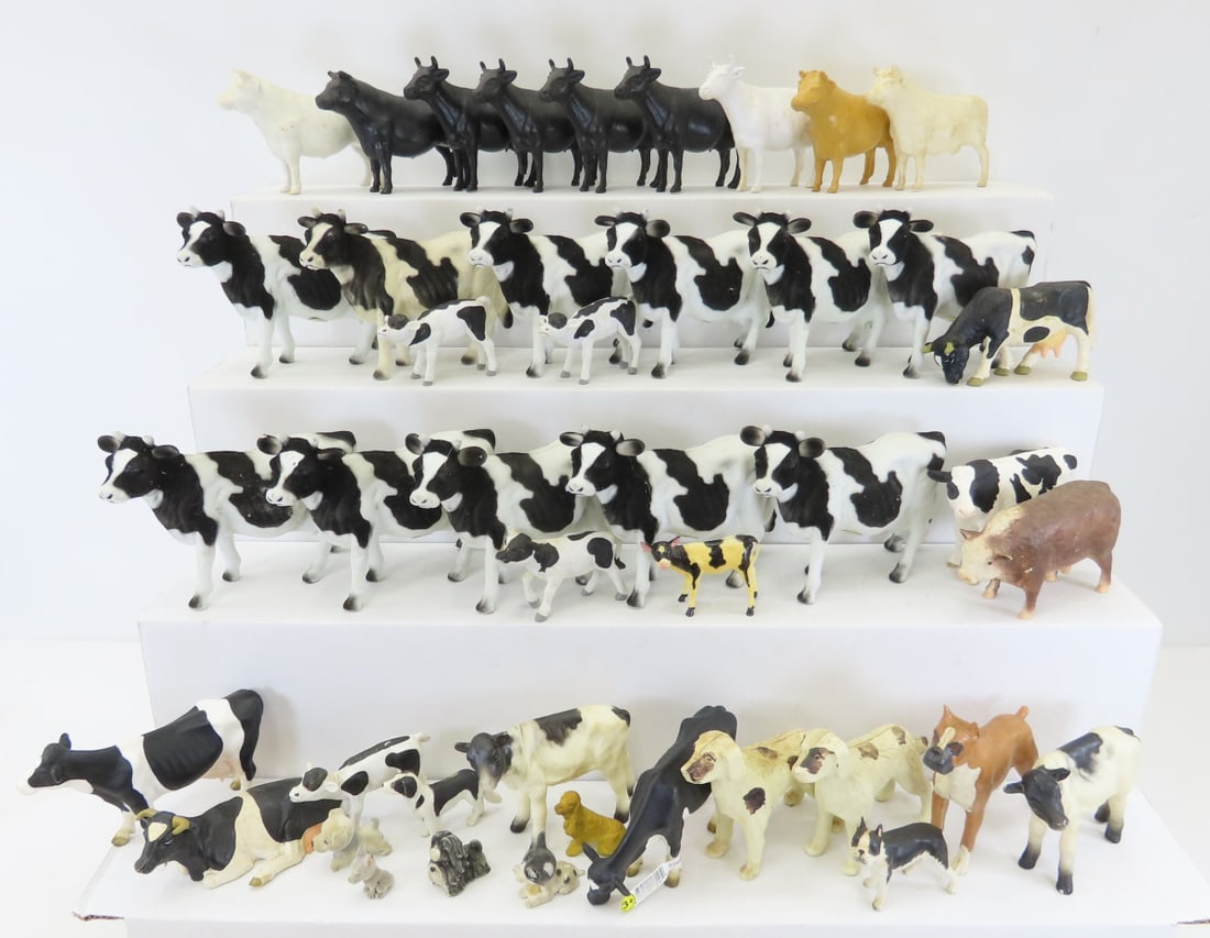 Group of Schleich & Other Plastic Farm Animals: Group of Schleich & Other Plastic Farm Animals - 11 plastic felted Holsteins- made in China, 5 Black, 3 White & 1 tan hollow plastic cows, 3 Schleich Holsteins, 1 seated rubber Holstein, 2 Plastic