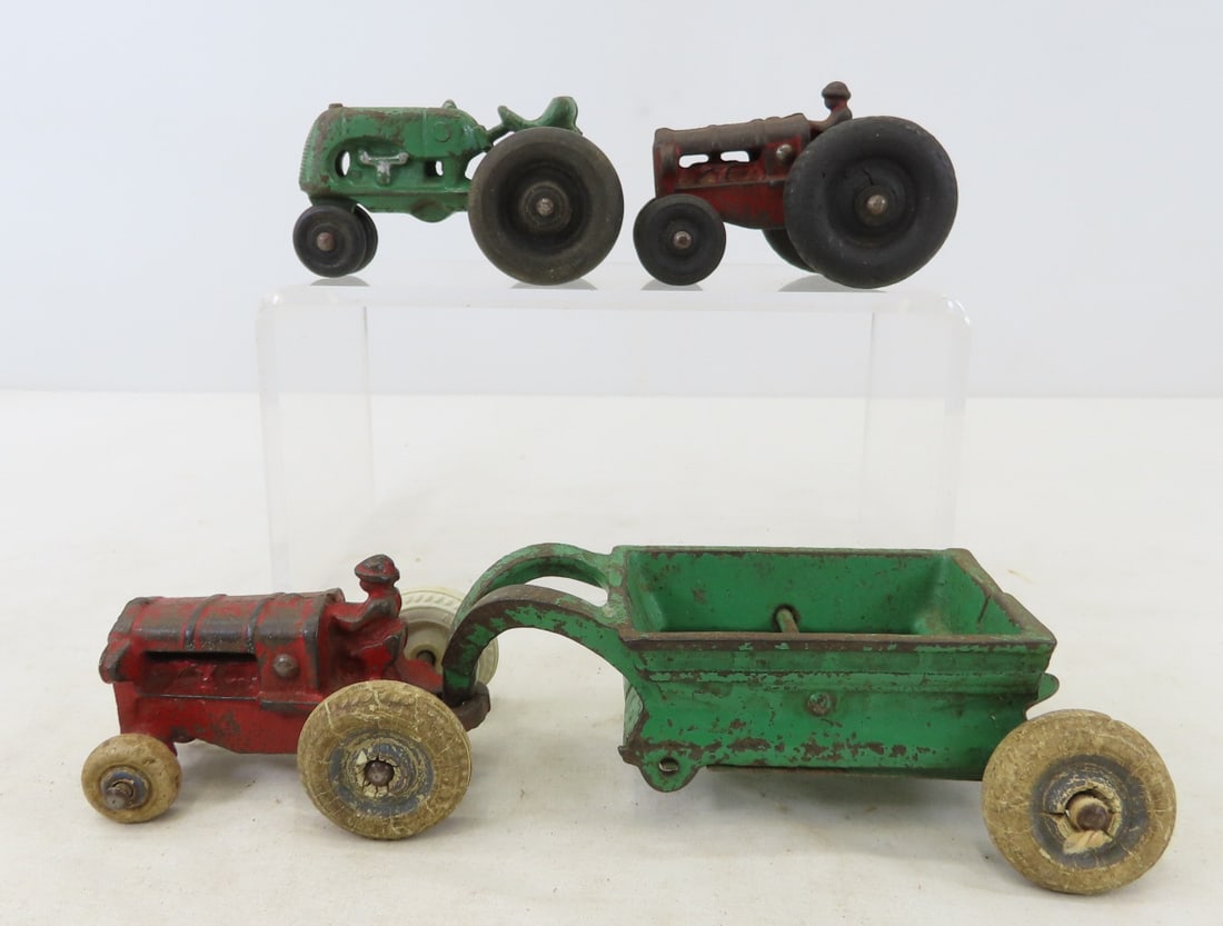 2 Arcade Tractors, Wagon & 1 Other Tractor: 2 Arcade Tractors, Wagon & 1 Other Tractor - (2) 3" Arcade tractors with assorted wheels, green Arcade wagon, 1 unmarked green tractor with wood wheels, LOT SIZE: 8x5x3" 2 LBS