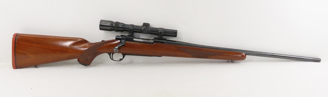 Ruger M77 250 Savage Rifle With Scope: Ruger M77 250 Savage Rifle With Scope - SN# 70-49494, bolt action, 21" barrel, original tang safety model, checkered wood pistol grip stock, sling swivel mounting studs, mfg. 1963, Weaver V45-1 scope.