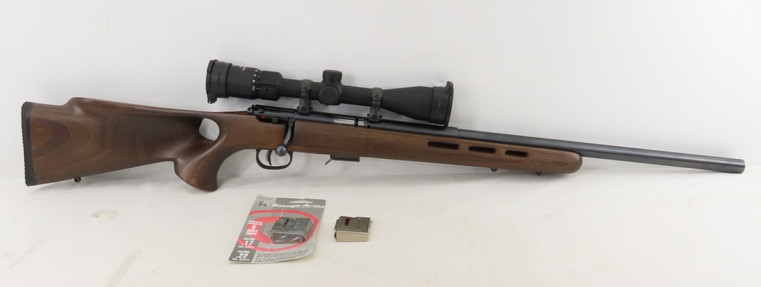 Savage Model 93R17 Bolt Action .17 HMR Rifle: Savage Model 93R17 Bolt Action .17 HMR Rifle - SN# 0980172. Matte blue finish, Accu-trigger, thumb hole vented beaver tail contoured wood stock with recoil pad, swivel mounts, 21”-barrel. Scope