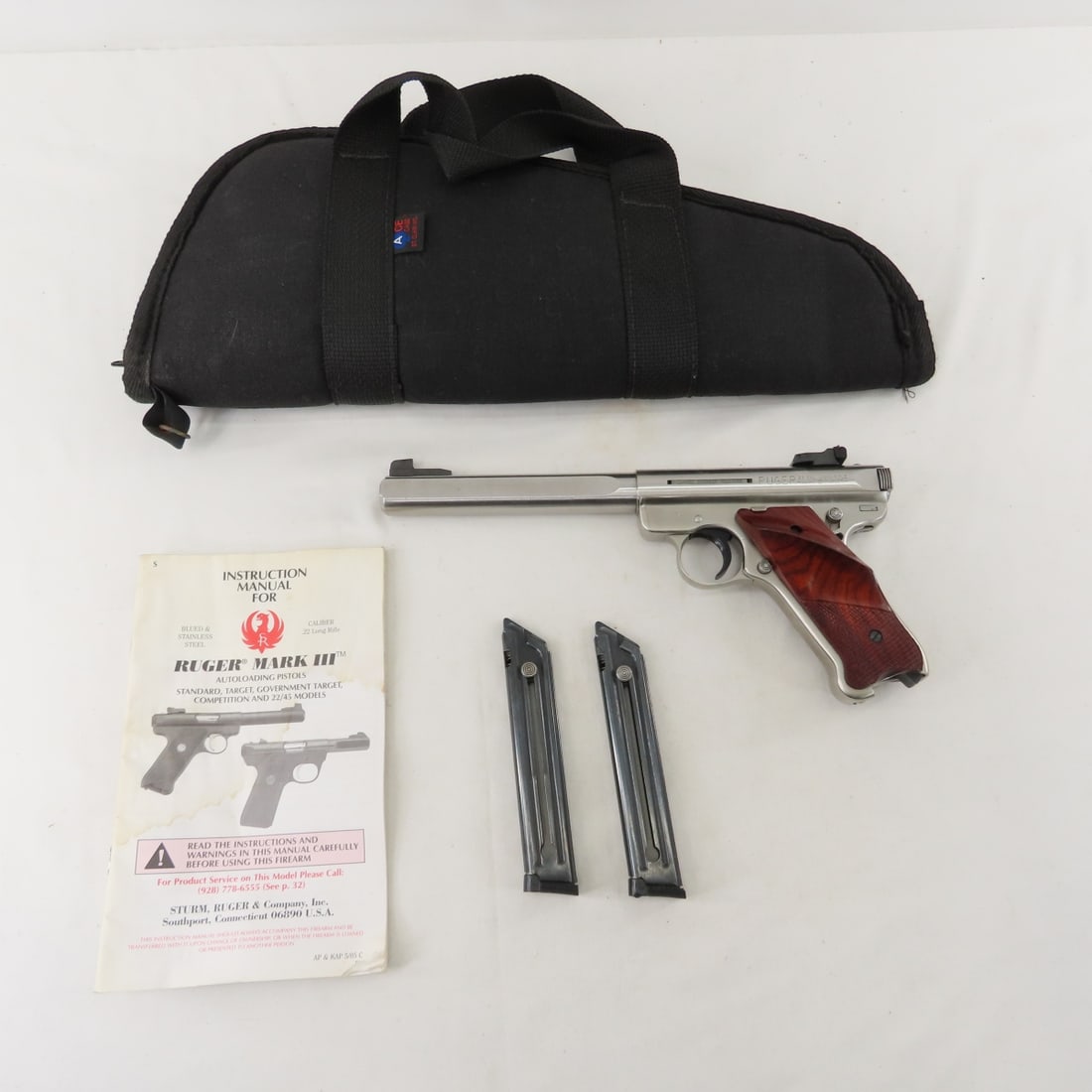 Ruger Mark III Competition Target .22 cal Pistol: Ruger Mark III Competition Target .22 cal Pistol - SN # 227-20686, stainless, 6.5" barrel, 2 magazines, checkered rosewood grips with logo medallion, and soft case. mfg 2005. Very good condition. FFL