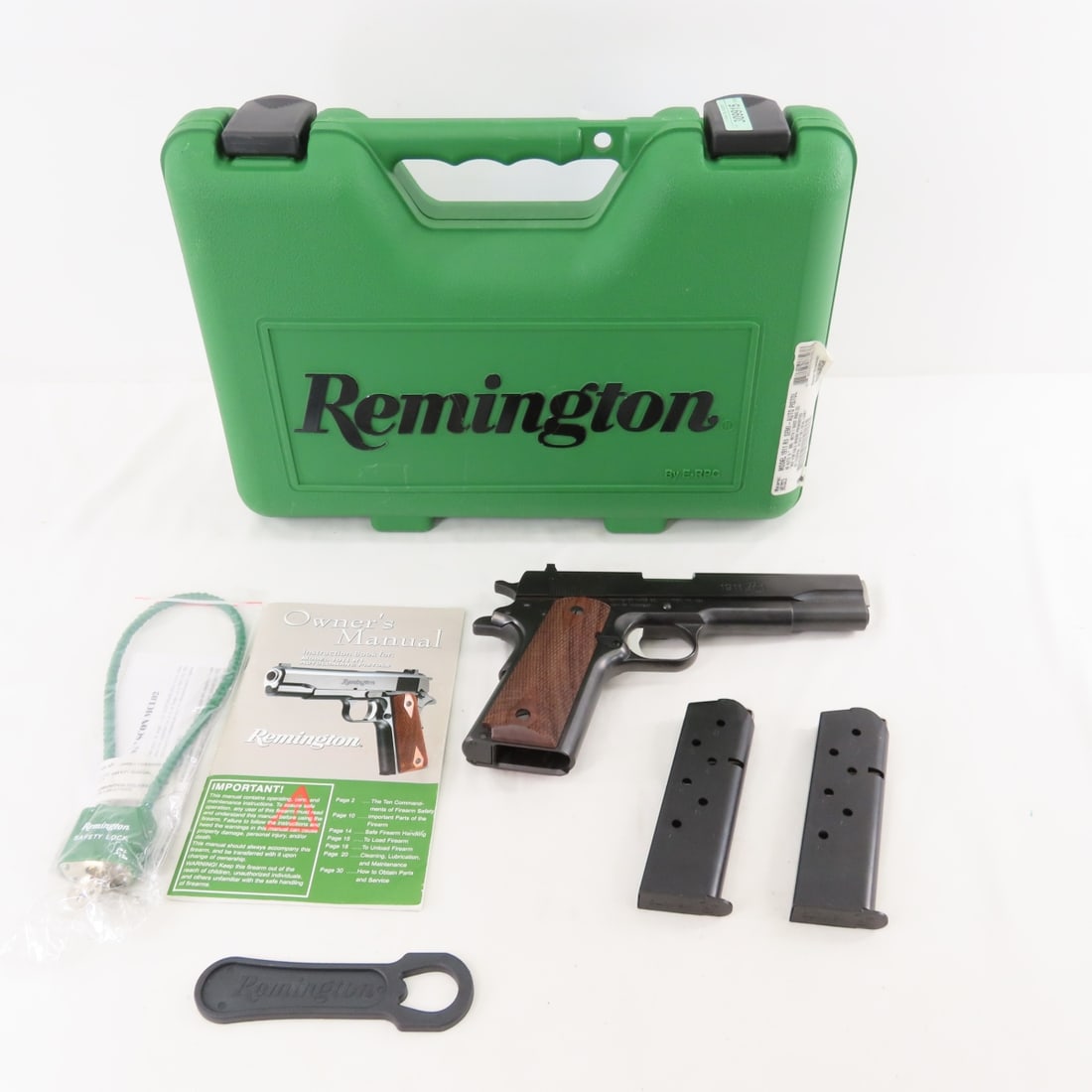 Remington Model 11 R1 Semi Auto Pistol .45 Auto: Remington Model 11 R1 Semi Auto Pistol .45 Auto - SN# RH83625A, 5" barrel, 3 dot sights, checkered wood grips, 2 7 shot magazines, lock and tool, with original case and booklet. Very good condition.