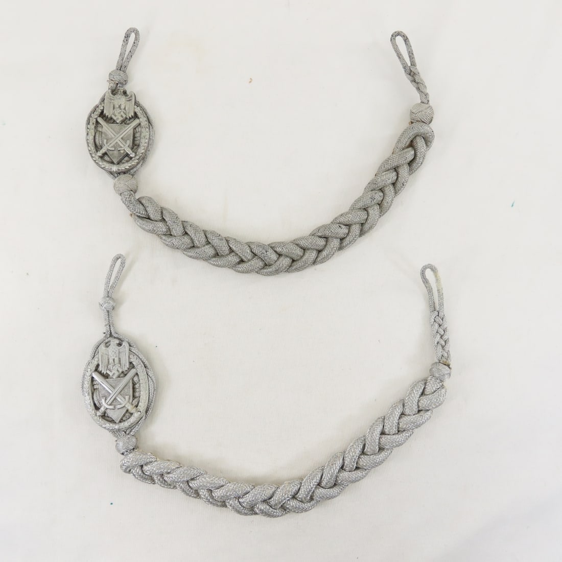 2 WWII German Heer Shooting Lanyards: 2 WWII German Heer Shooting Lanyards - Lot Size 6x6x6" 2 LB All information and photos are intended to be as accurate as possible, but errors are possible. No item may be returned or refused based on