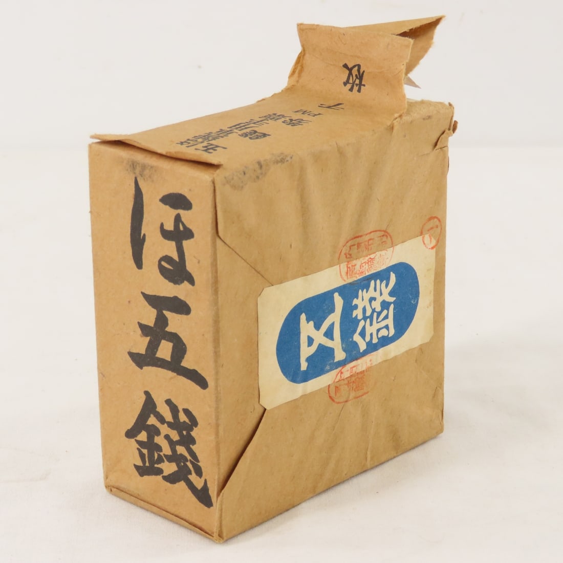 1000 WWII Japanese Government 5 Centavos Notes: 1000 WWII Japanese Government 5 Centavos Notes - Uncirculated in Original brown paper wrap. Series PM , some tears in paper wrapping. Actual weight of the pack is 390 grams. Lot Size 4x4x2" 1 LB All