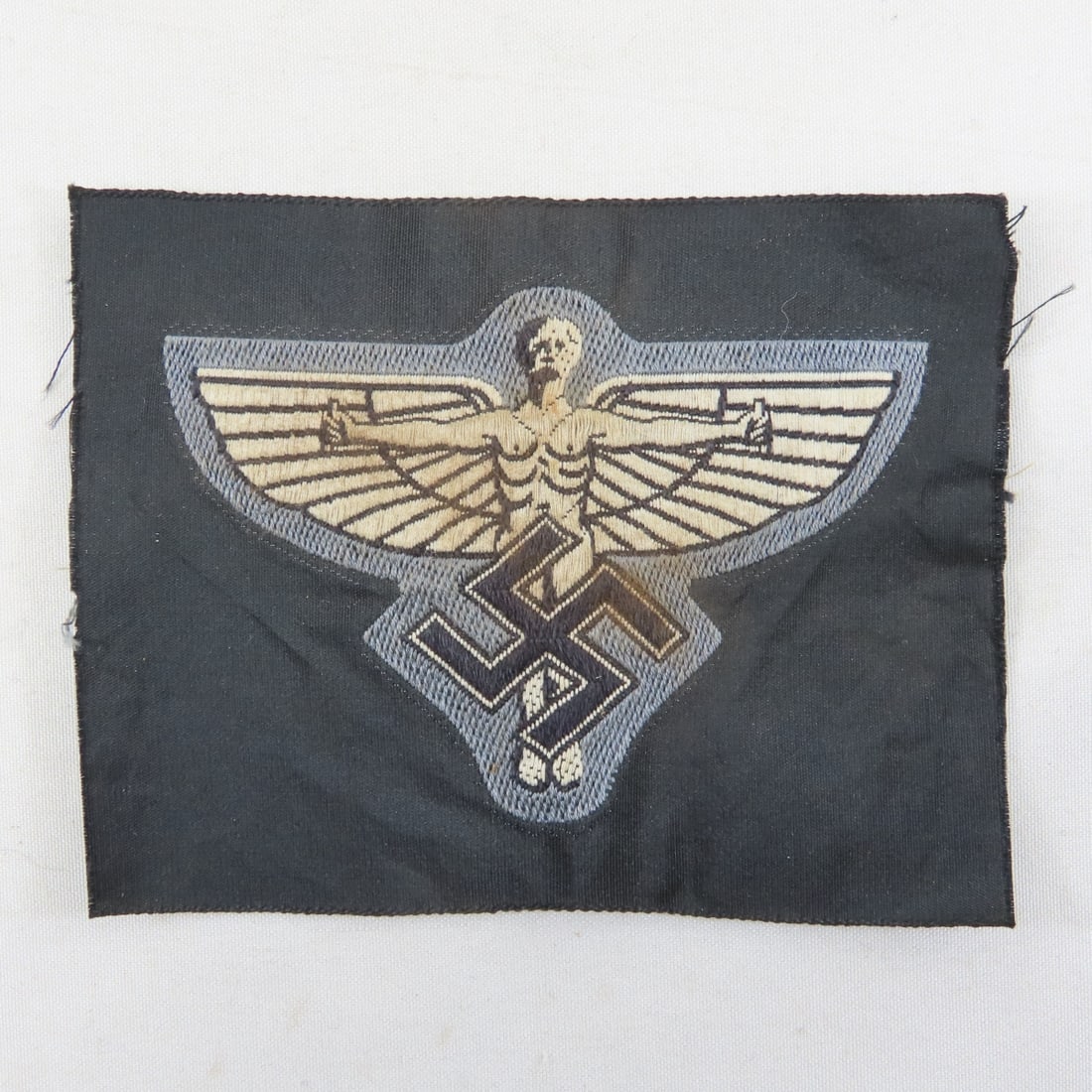 WWII German NSFK Cloth Sleeve Eagle: WWII German NSFK Cloth Sleeve Eagle - Lot Size 4x3x1" 1 LB All information and photos are intended to be as accurate as possible, but errors are possible. No item may be returned or refused based on