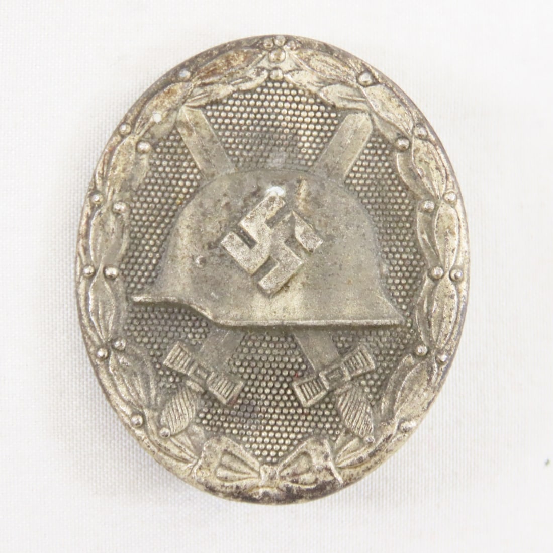 WWII German Silver Wound Badge marked 65: WWII German Silver Wound Badge marked 65 - Lot Size 3x2x1" 1 LB All information and photos are intended to be as accurate as possible, but errors are possible. No item may be returned or refused
