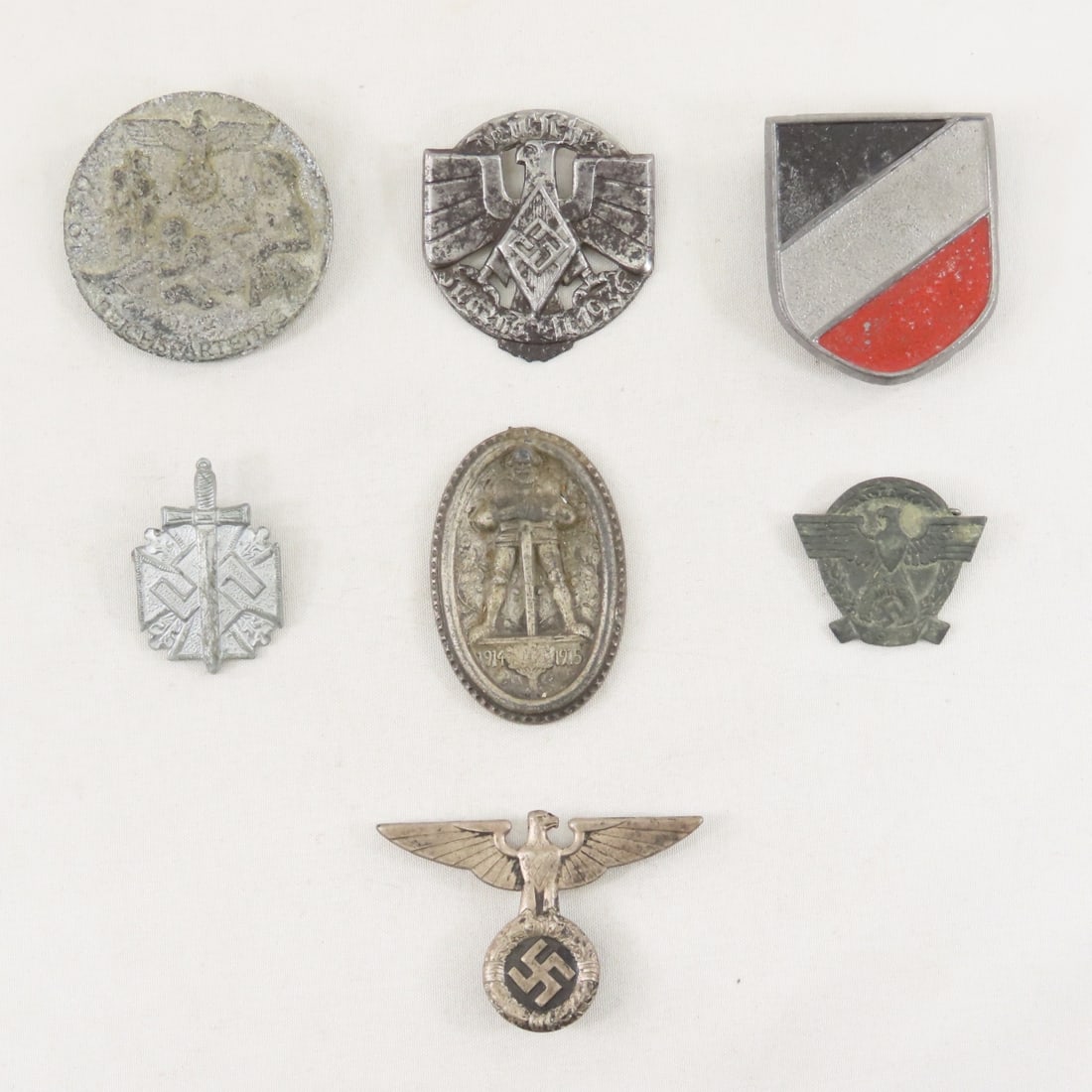 7 WWII German Tinnies: 7 WWII German Tinnies - Lot Size 3x3x3" 1 LB All information and photos are intended to be as accurate as possible, but errors are possible. No item may be returned or refused based on this