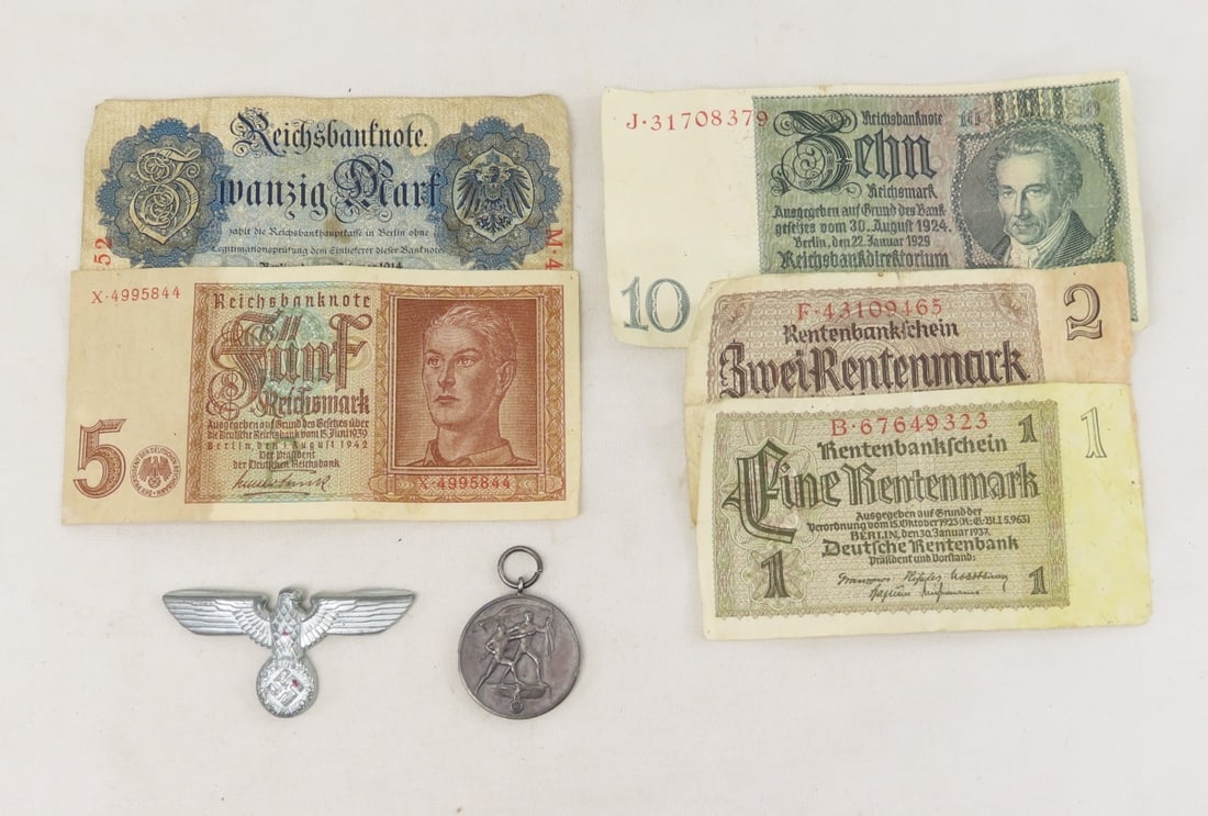WWII Era German Cap Badge, Medal & Notes: WWII Era German Cap Badge, Medal & Notes - 1938 Anschluss Medal marked "EIN VOLK EIN REICH EIN FUHRER 13 MARZ 1938". One 1942 note and four pre-1938 notes. LOT SIZE: 7x4x1", 1 LB All information and