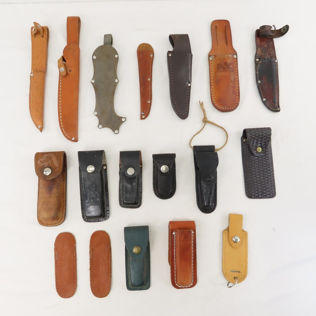 Collection of leather knife sheaths: Collection of leather knife sheaths - Lot Size 8x8x8" 2 LB All information and photos are intended to be as accurate as possible, but errors are possible. No item may be returned or refused based on