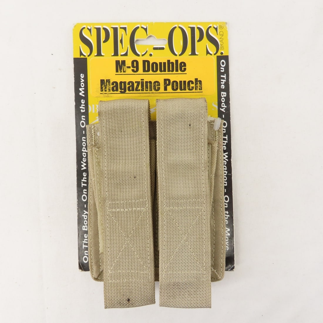 Spec.-Ops. M9 pistol double magazine pouch- New: Spec.-Ops. M9 pistol double magazine pouch- New - in coyote tan Nylon. Lot Size 8x5x1" 1 LB All information and photos are intended to be as accurate as possible, but errors are possible. No item may