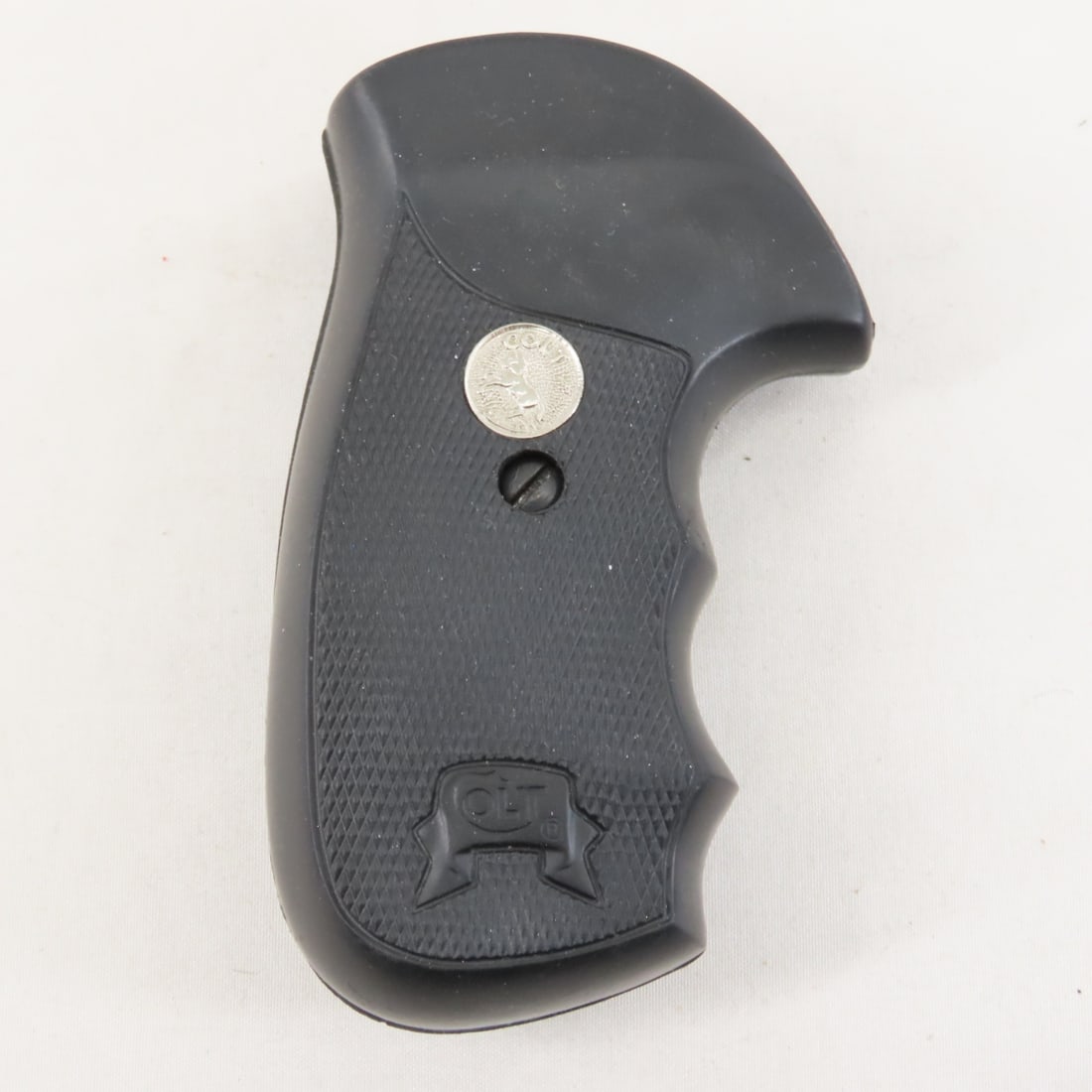 1990’s 2-piece grips for Colt Mark V frame handgun: 1990’s 2-piece grips for Colt Mark V frame handgun - Rounded bottom profile. Textured black rubber with silver Colt emblems and Colt in scrollwork molded in. Inside marked as being made by their