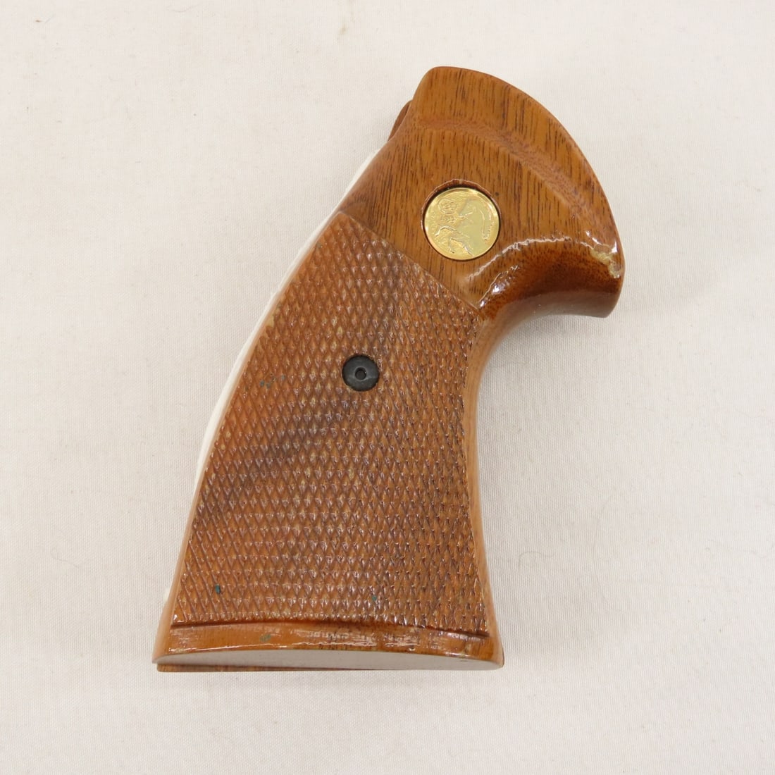 1986 2-piece Cold Python wood grips: 1986 2-piece Cold Python wood grips - Gold emblems, with the Colt 150 logo, released for Colt’s 150th anniversary in 1986. Includes the mounting screw. Very good used take-off’s of a rare