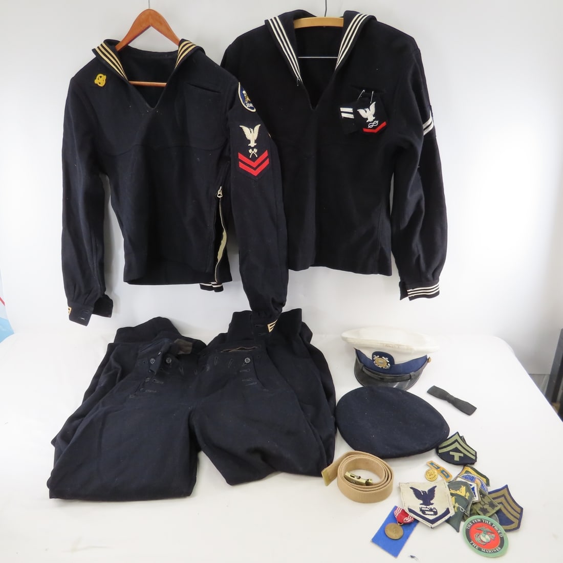 WWII Navy Uniform, Caps, Insignia & more: WWII Navy Uniform, Caps, Insignia & more - Lot Size 18x14x12" 10 LB All information and photos are intended to be as accurate as possible, but errors are possible. No item may be returned or refused